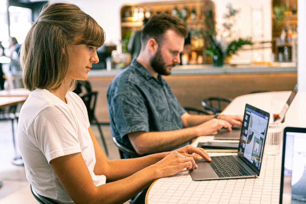 two coworkers on laptop